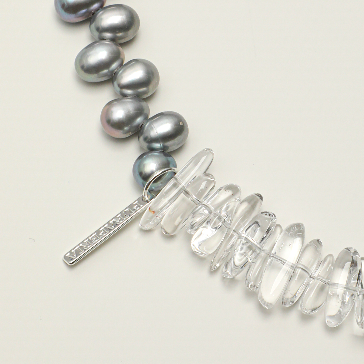 Clear quartz stones and long tag detail