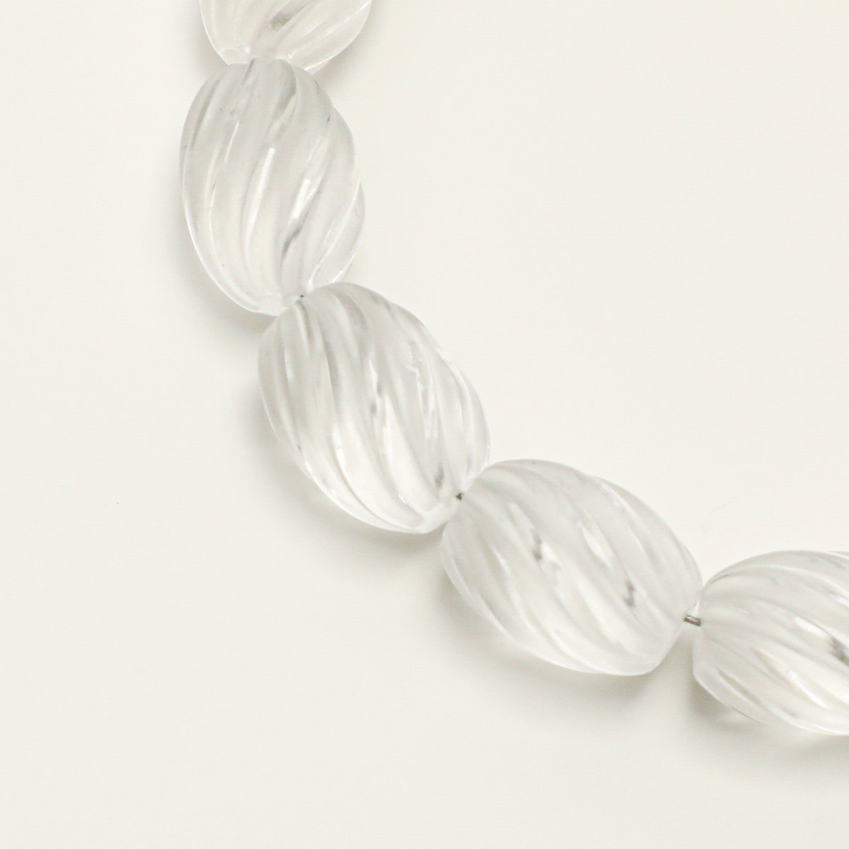 Twisted oval clear quartz bead detail