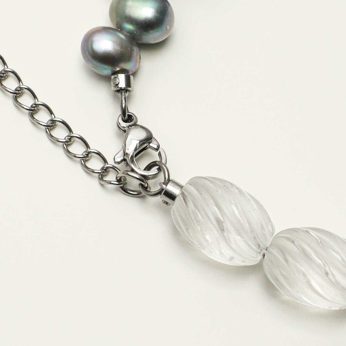 Silver-plated 316L stainless steel lobster clasp and extender chain detail