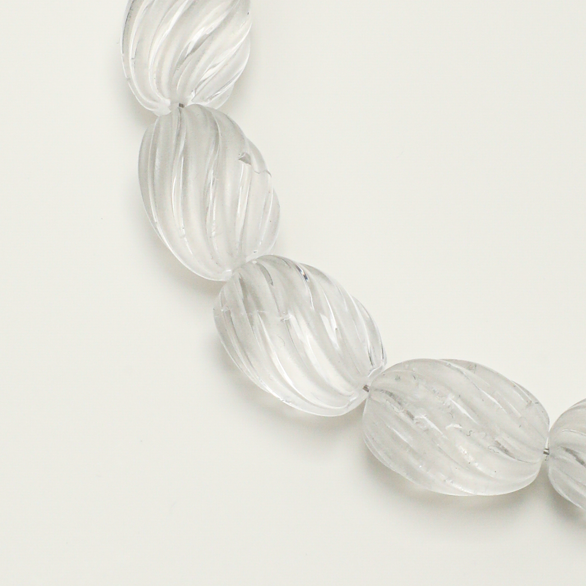 Carved clear quartz bead detail