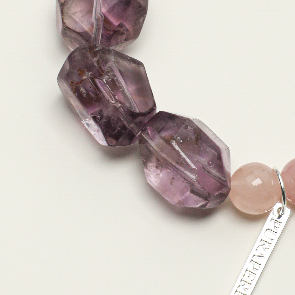 Freeform amethyst stones and rose quartz bead detail