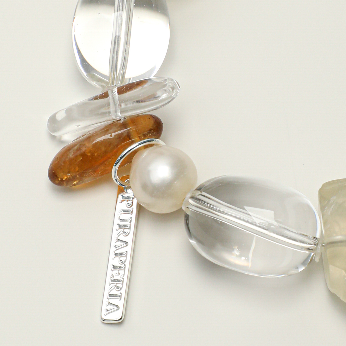 Pearl, elongated quartz and citrine accent with tag