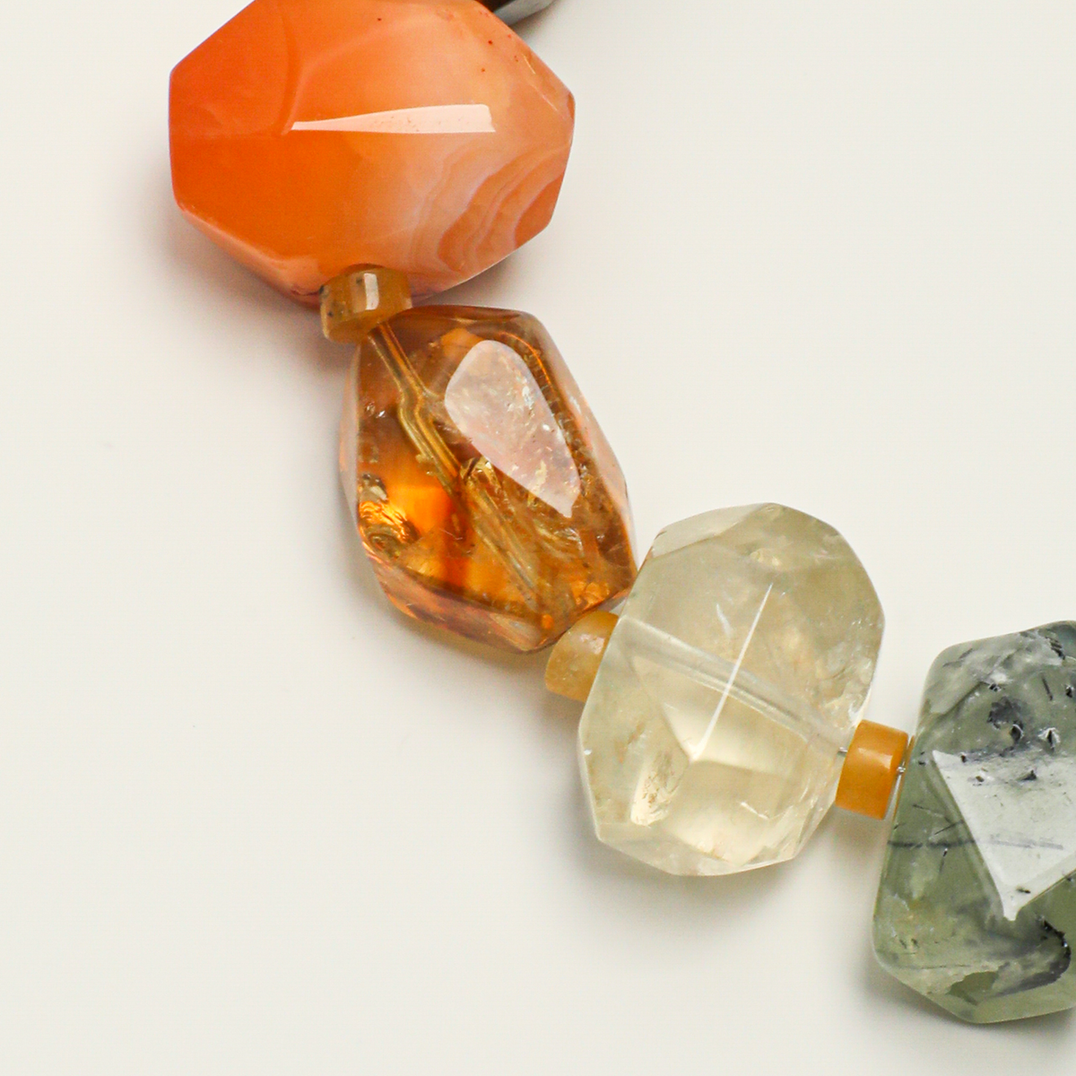 Red agate, citrine, prehnite, and warm-toned gemstone detail