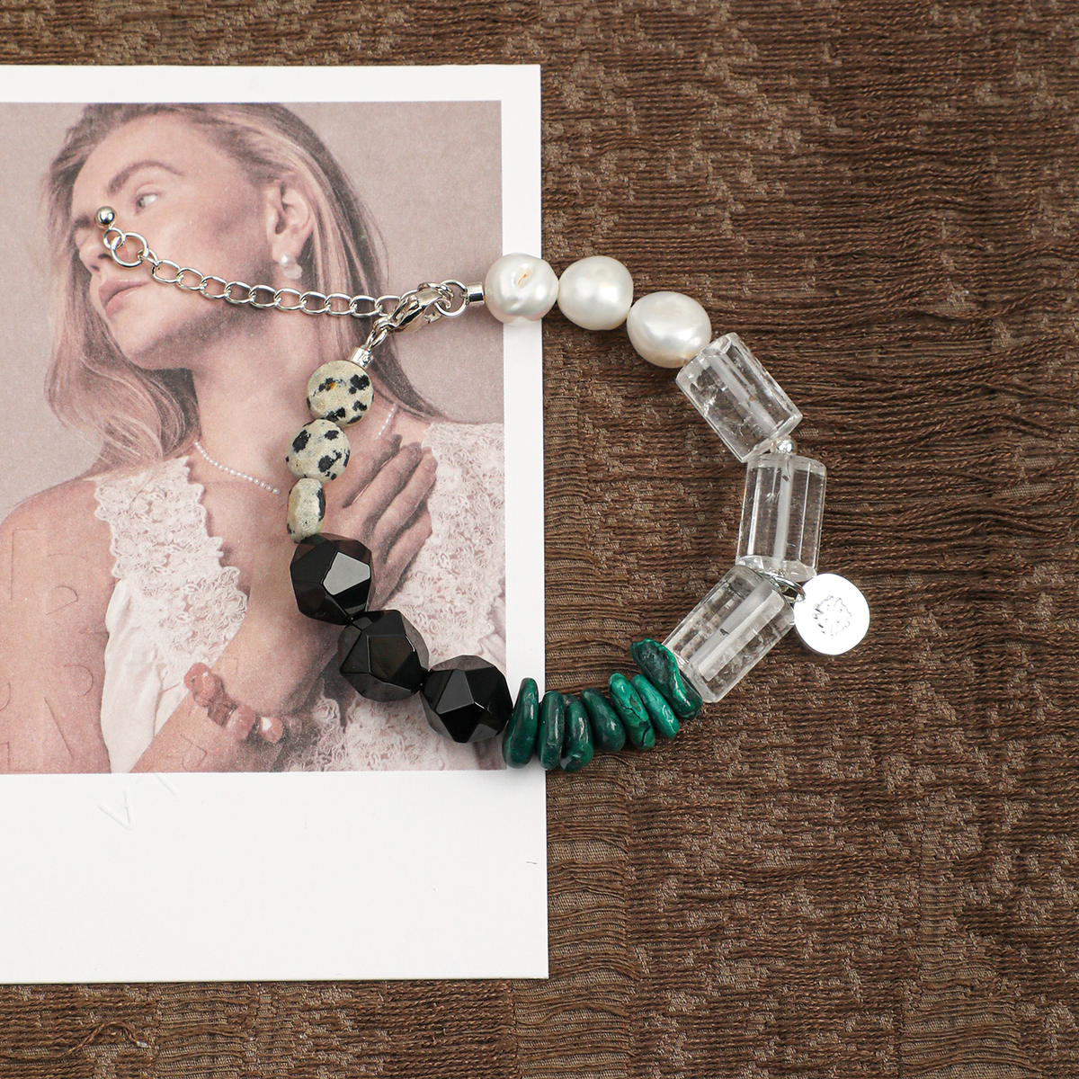 Mixed gemstone and pearl adjustable bracelet in a lifestyle setting