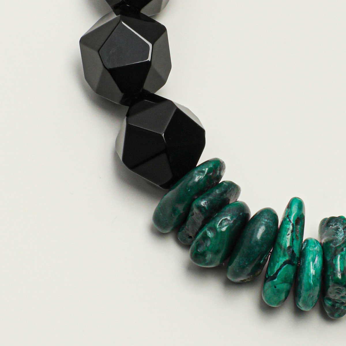 Faceted black agate and malachite chip bead detail