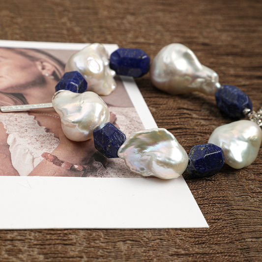 Baroque pearl and lapis lazuli bracelet styled close-up