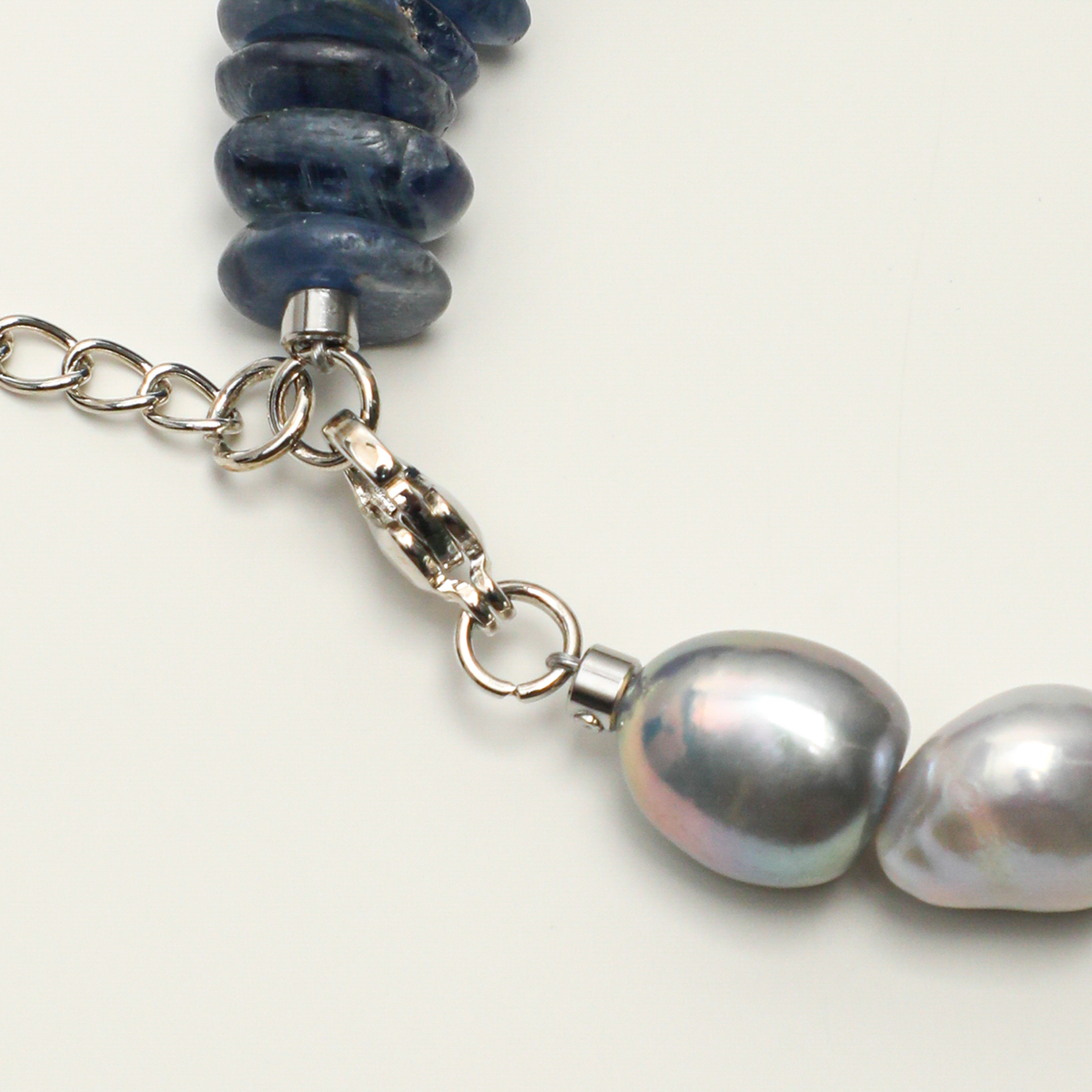 Lobster clasp, gray baroque pearls and blue kyanite detail