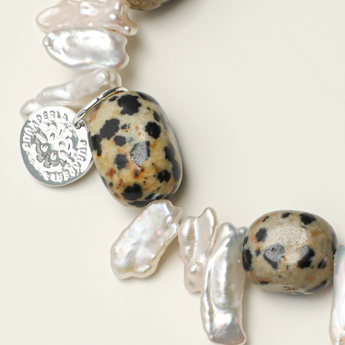 Round engraving tag, Dalmatian jasper and elongated baroque pearl detail