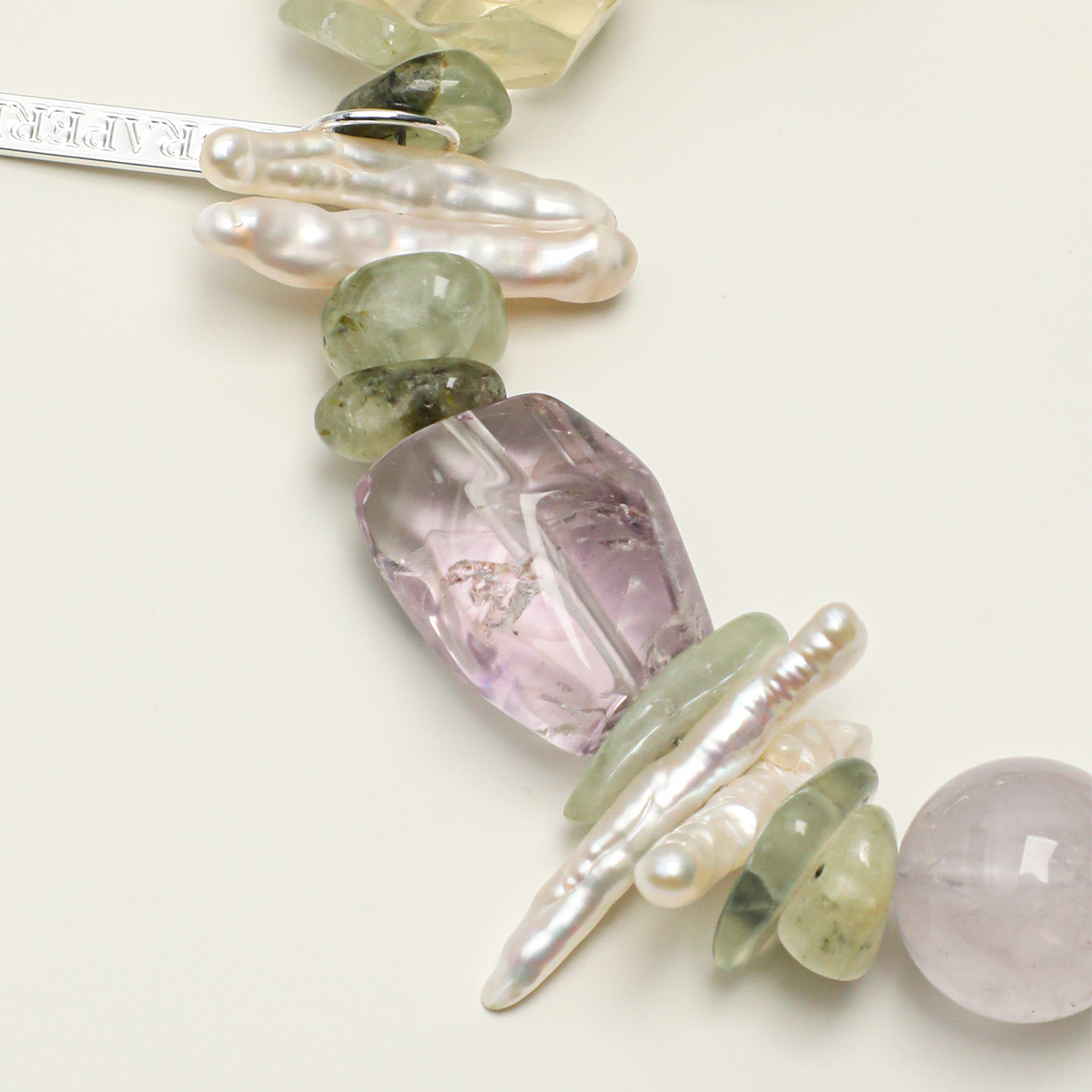 Freeform amethyst, prehnite, elongated baroque pearl and long tag detail