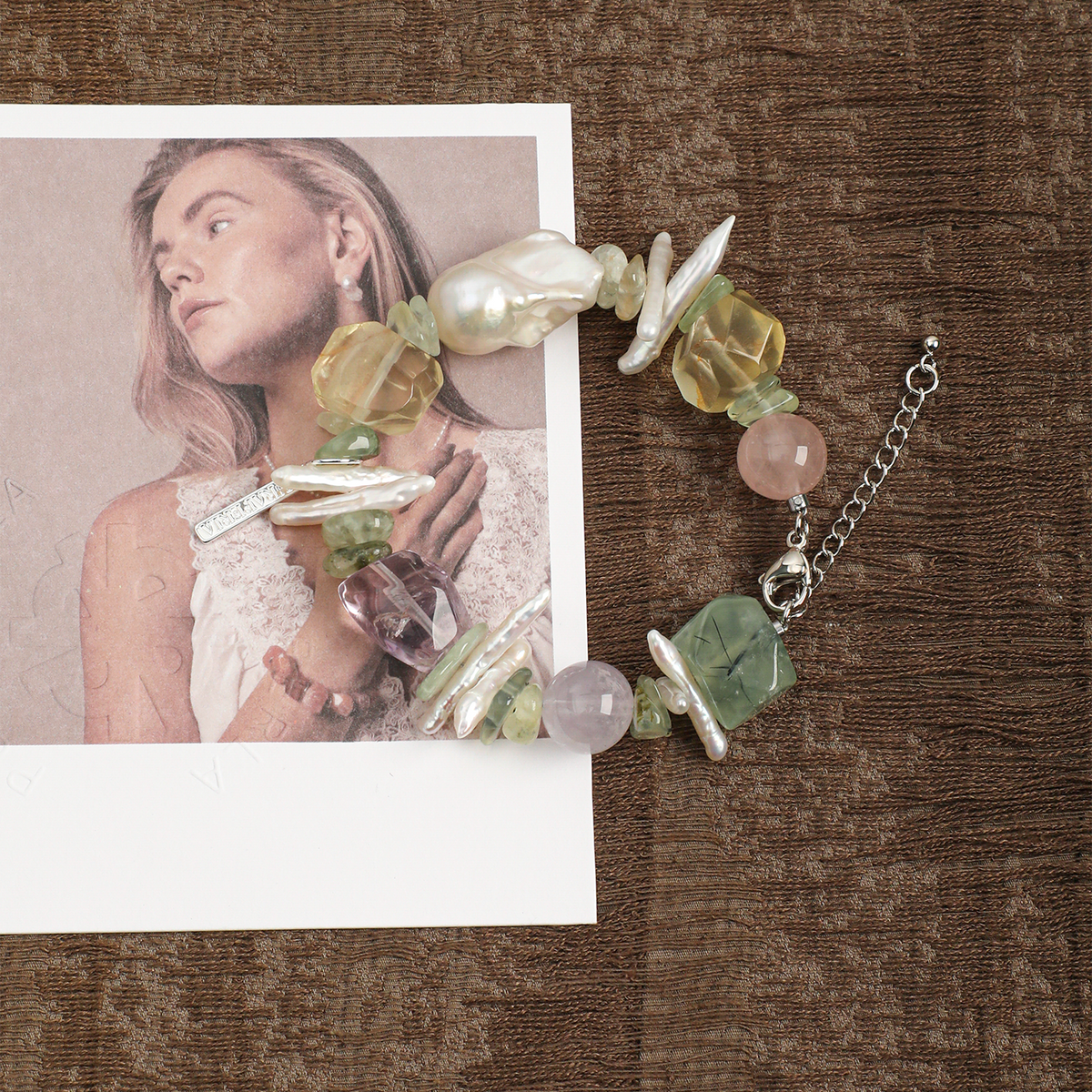 Prehnite, citrine, amethyst and pearl bracelet in a lifestyle setting